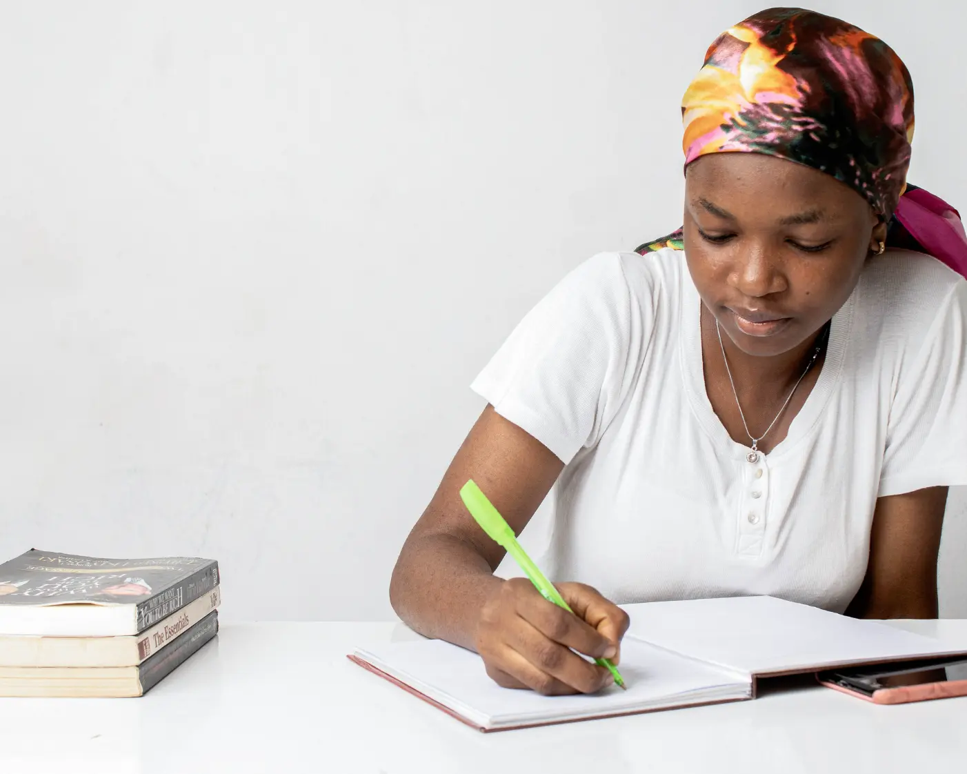 Young African woman writing in notebook — CRF philosophy