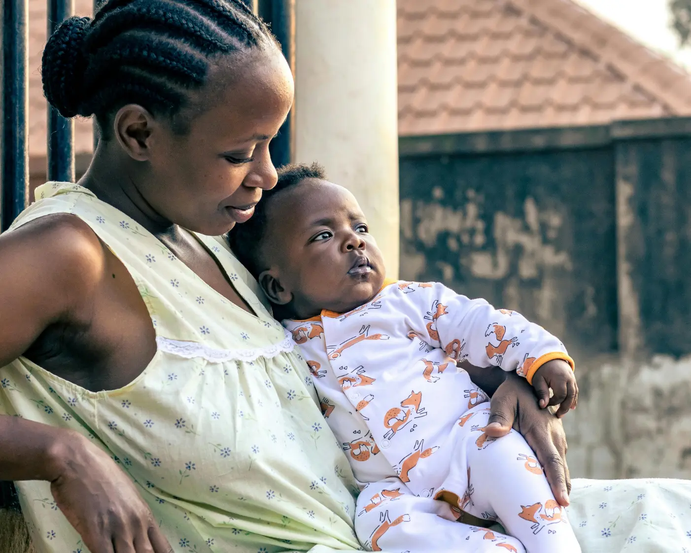 Young mother sitting with her baby — tender and hopeful