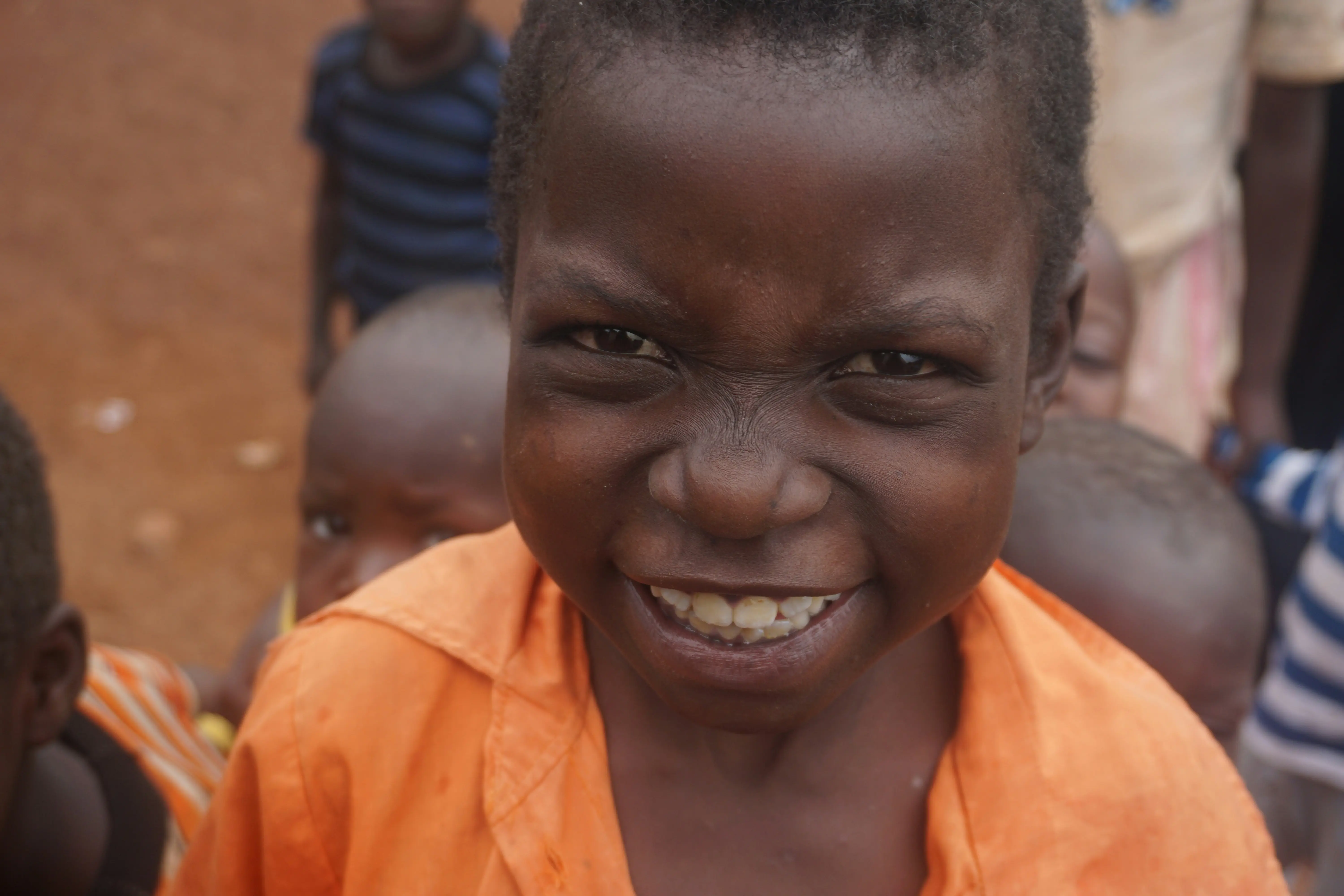 Children laughing together at CRF outreach — joy and community